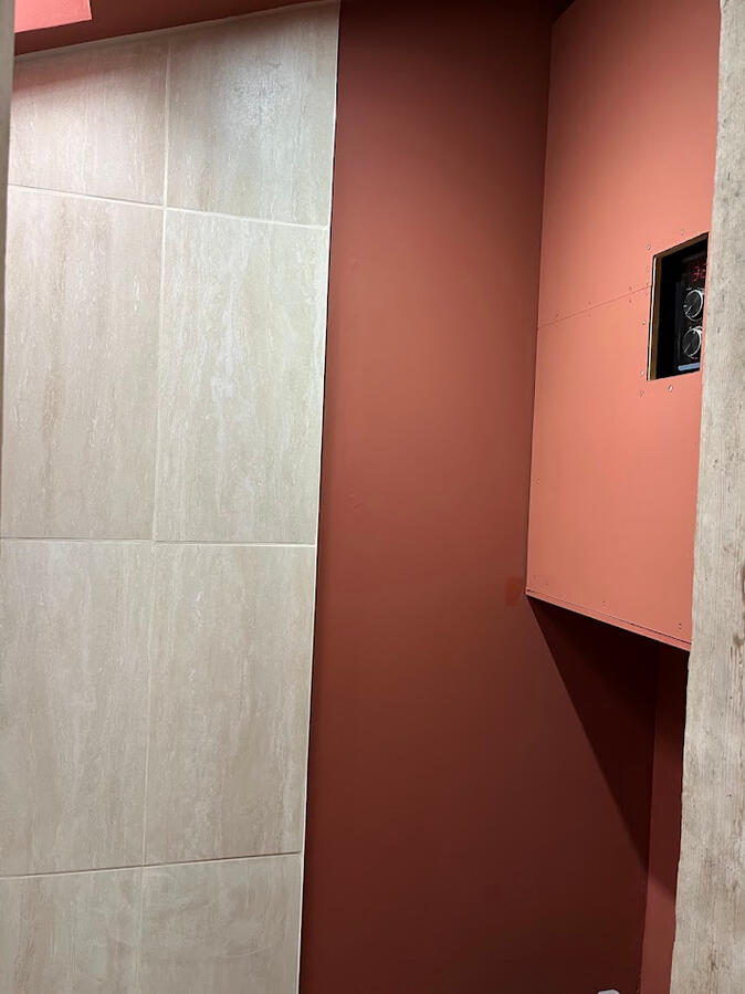 Finished tiling with edging and taped & seamed wall primed and emulsioned, next to boiler cover Finished tiling with edging and taped & seamed wall primed and emulsioned, next to boiler cover
